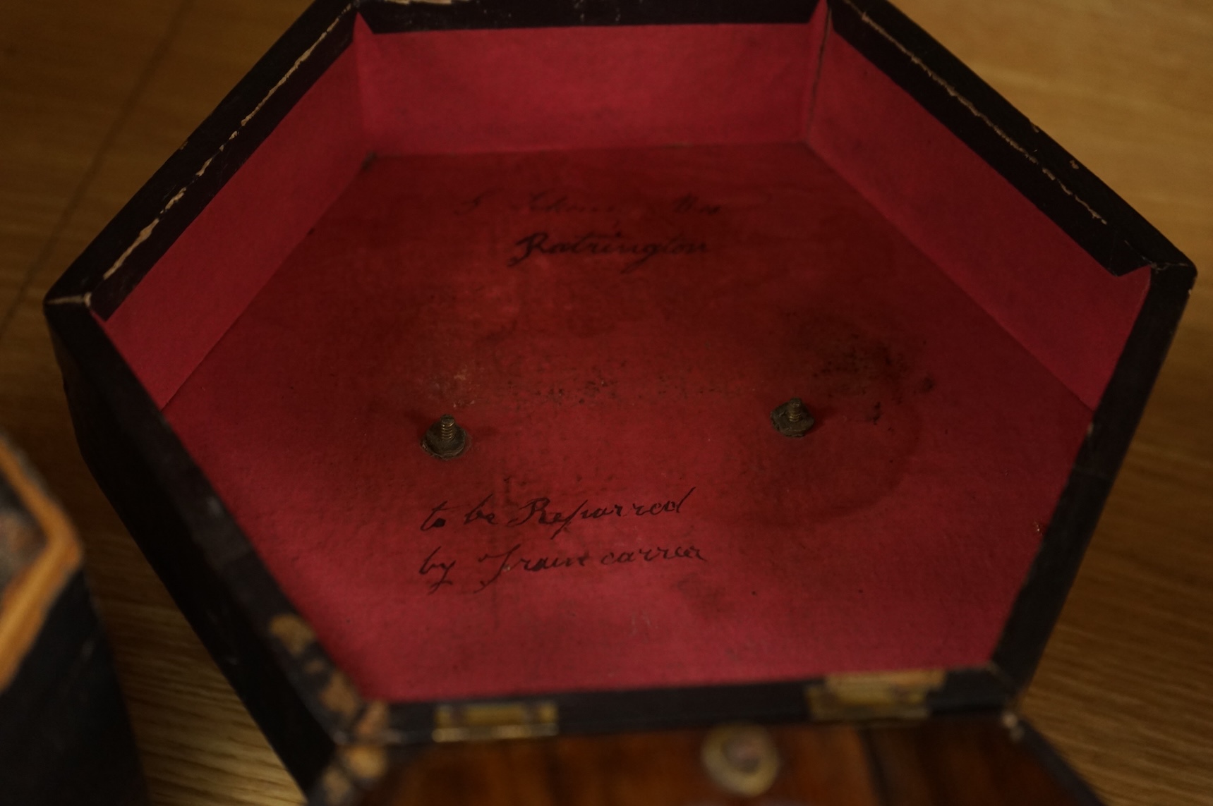 Two cased concertinas; one in mahogany with original paper label for Lachenal & Co., London, the other in rosewood (a.f.)